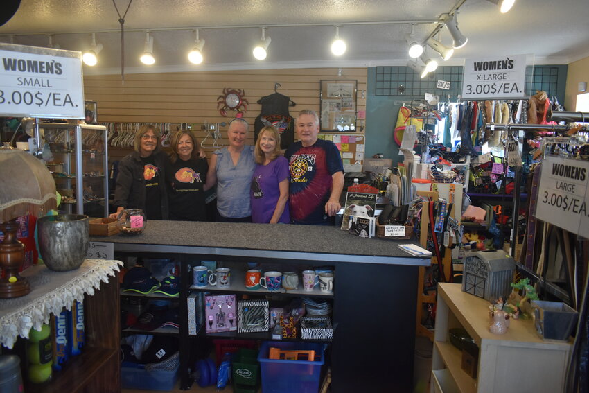 Volunteers at the Soul Dog Rescue & Humane Society thrift store Cythina Petsch, Janet Yench, Kimberleigh Anders, Wendi Roth and Mike Noland stand behind the counter at the store on Aug. 16, 2023